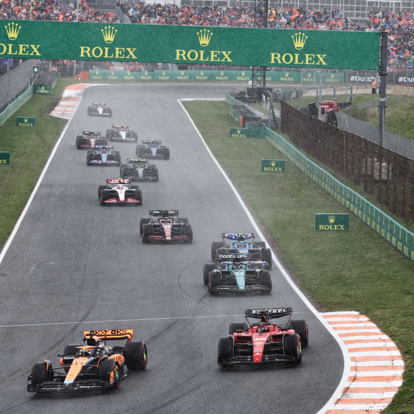 (L to R): Oscar Piastri (AUS) McLaren MCL60 and Charles Leclerc (MON) Ferrari SF-23 battle for position at the start of the