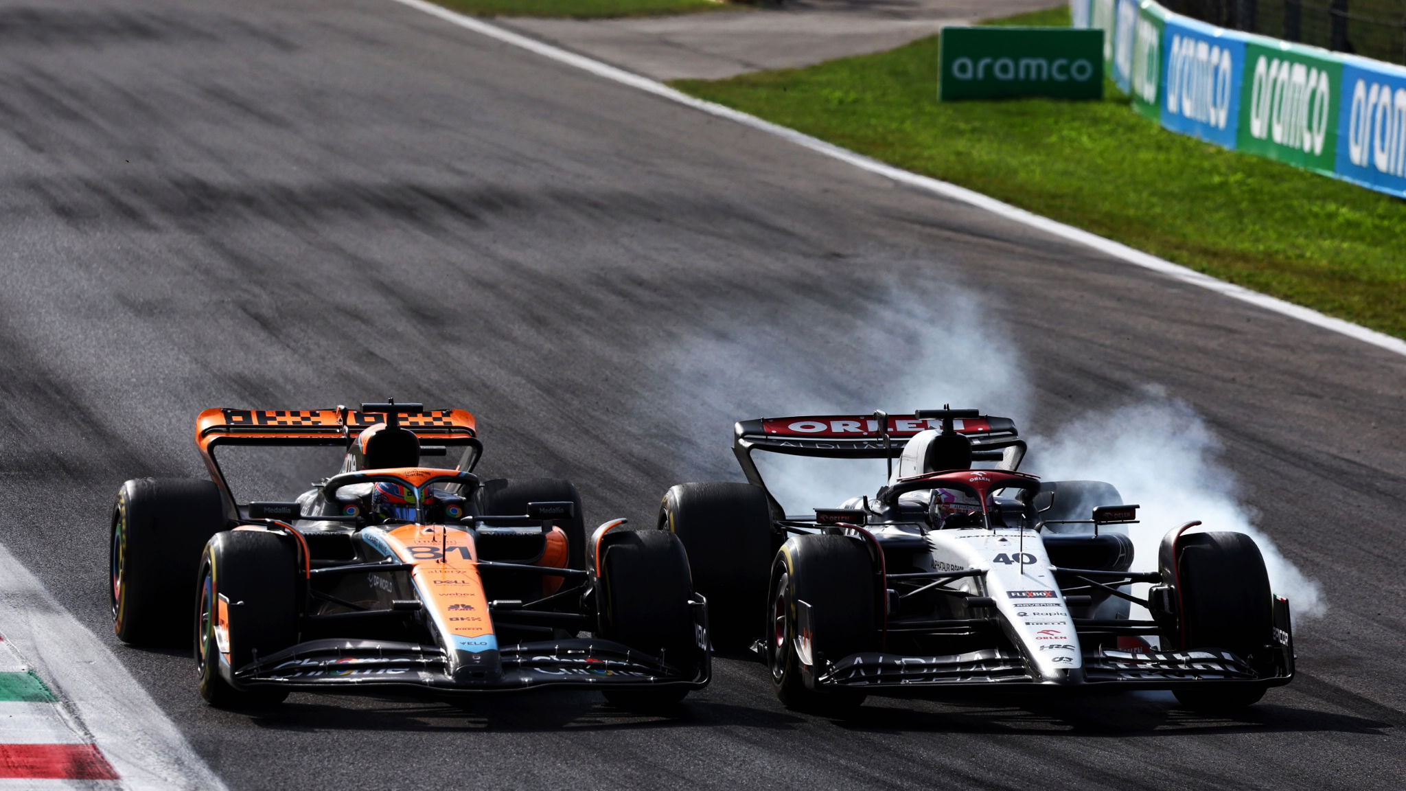 Oscar Piastri (AUS) McLaren MCL60 and Liam Lawson (NZL) AlphaTauri AT04 battle for position. Formula 1 World Championship,