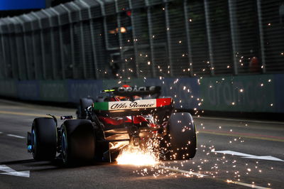 Zhou Guanyu (CHN) Alfa Romeo F1 Team C43 sends sparks flying. Formula 1 World Championship, Rd 16, Singapore Grand Prix,
