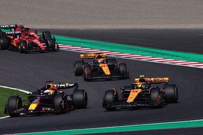 (L to R): Max Verstappen (NLD) Red Bull Racing RB19 and Lando Norris (GBR) McLaren MCL60 battle for position at the start of