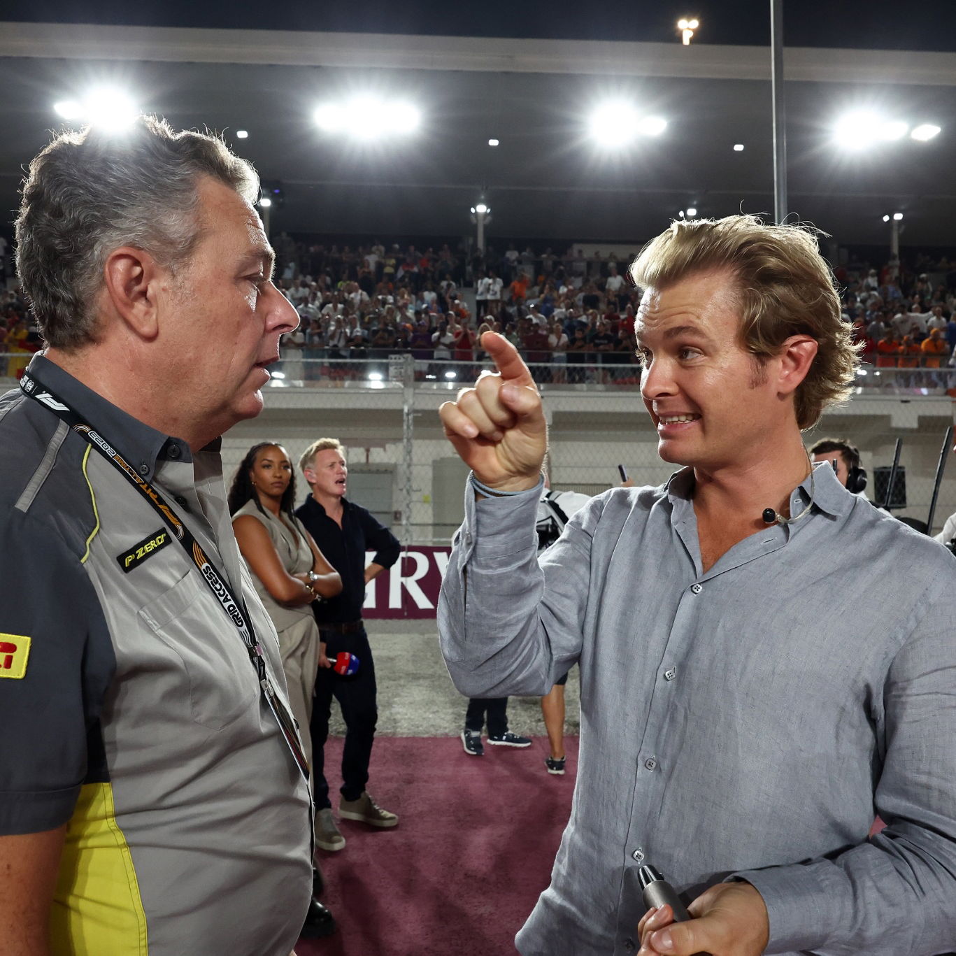 (L to R): Mario Isola (ITA) Pirelli Racing Manager with Nico Rosberg (GER). Formula 1 World Championship, Rd 18, Qatar