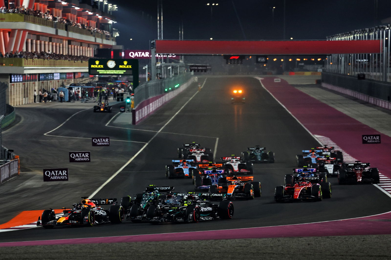 Max Verstappen (NLD) Red Bull Racing RB19 leads George Russell (GBR) Mercedes AMG F1 W14 and Lewis Hamilton (GBR) Mercedes