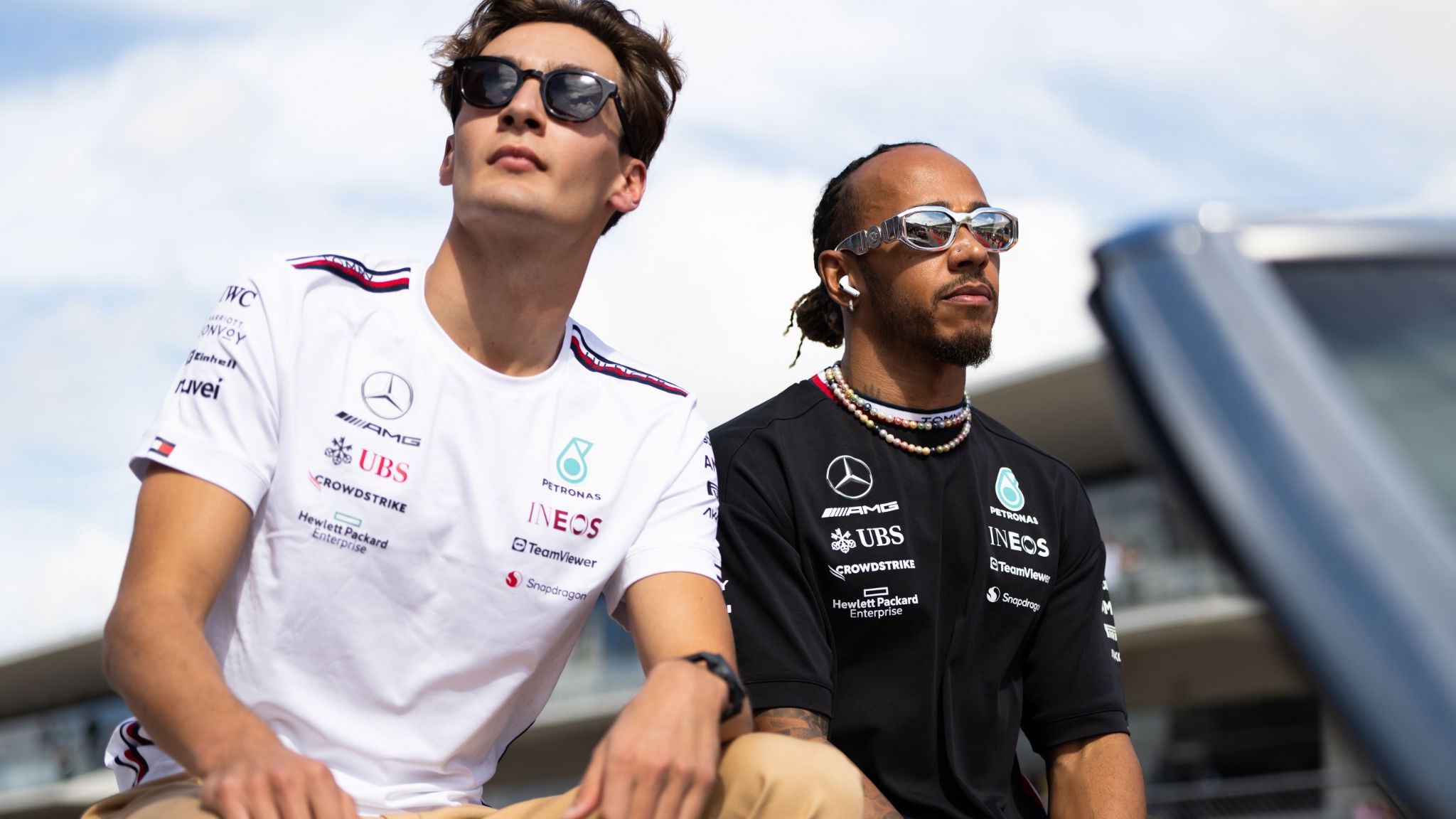 (L to R): George Russell (GBR) Mercedes AMG F1 and Lewis Hamilton (GBR) Mercedes AMG F1 on the drivers' parade. Formula 1