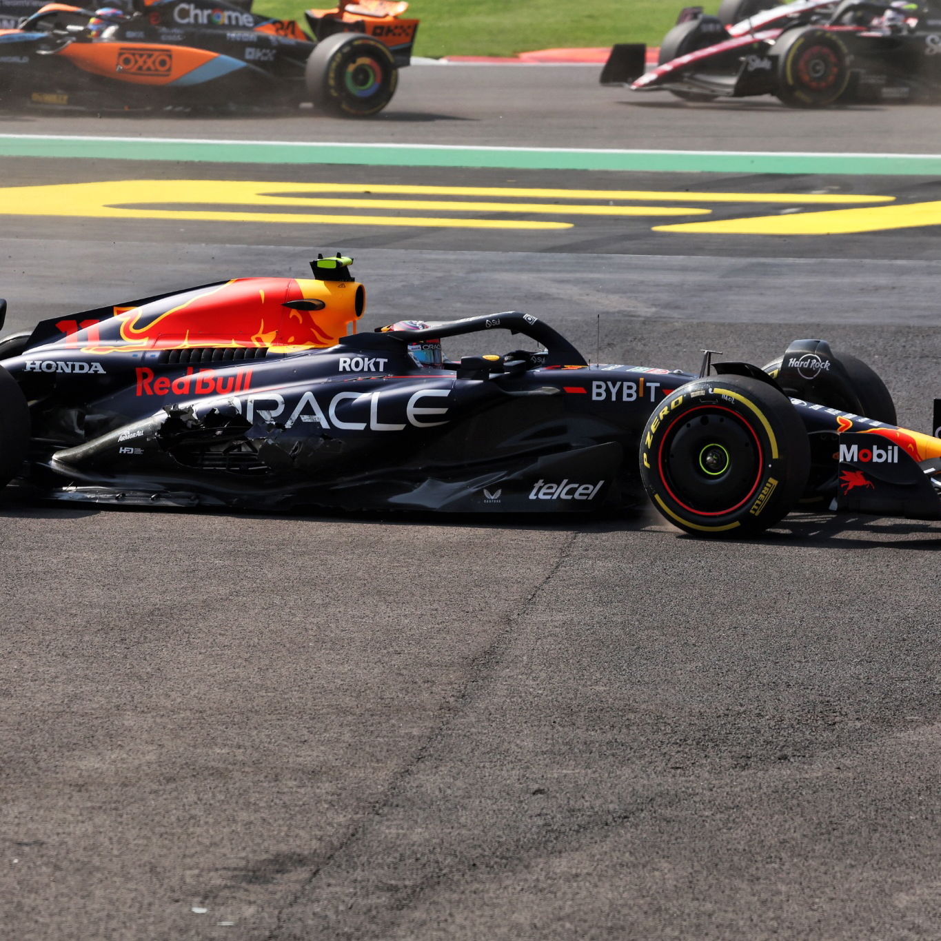 Sergio Perez (MEX) Red Bull Racing RB19 - crash at the start of the race. Formula 1 World Championship, Rd 20, Mexican