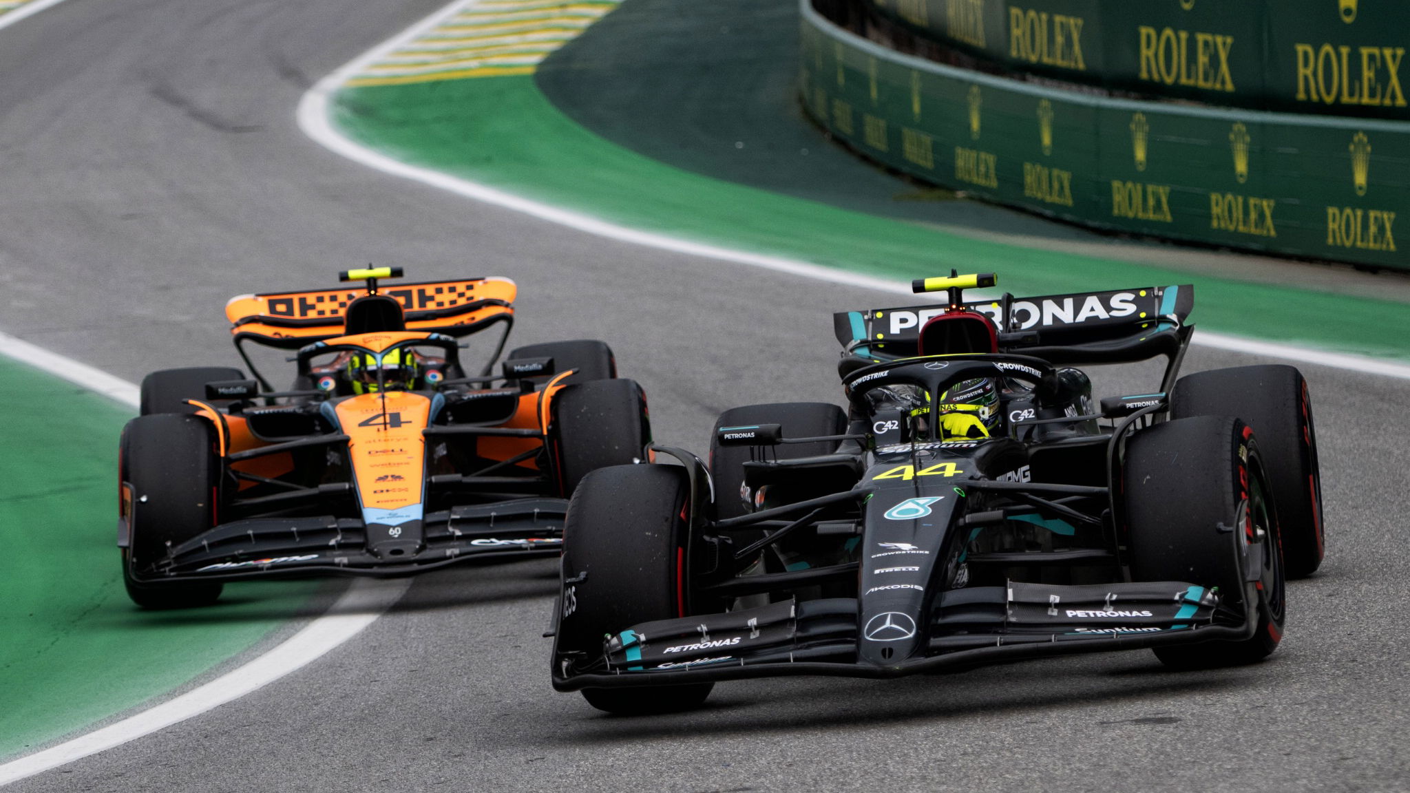 Lewis Hamilton (GBR) Mercedes AMG F1 W14 and Lando Norris (GBR) McLaren MCL60 leave the pits. Formula 1 World
