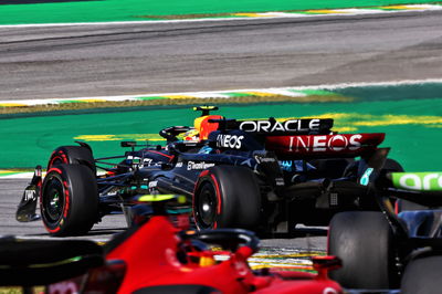 Sergio Perez (MEX) Red Bull Racing RB19 leads George Russell (GBR) Mercedes AMG F1 W14. Formula 1 World Championship, Rd