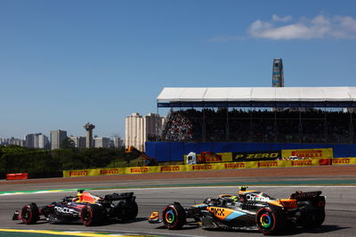 Max Verstappen (NLD) Red Bull Racing RB19 and Lando Norris (GBR) McLaren MCL60. Formula 1 World Championship, Rd 21,