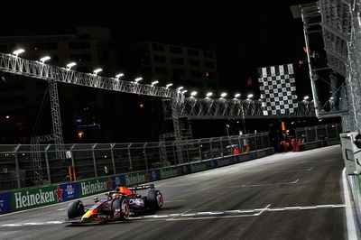 Race winner Max Verstappen (NLD) Red Bull Racing RB19 takes the chequered flag at the end of the race. Formula 1 World