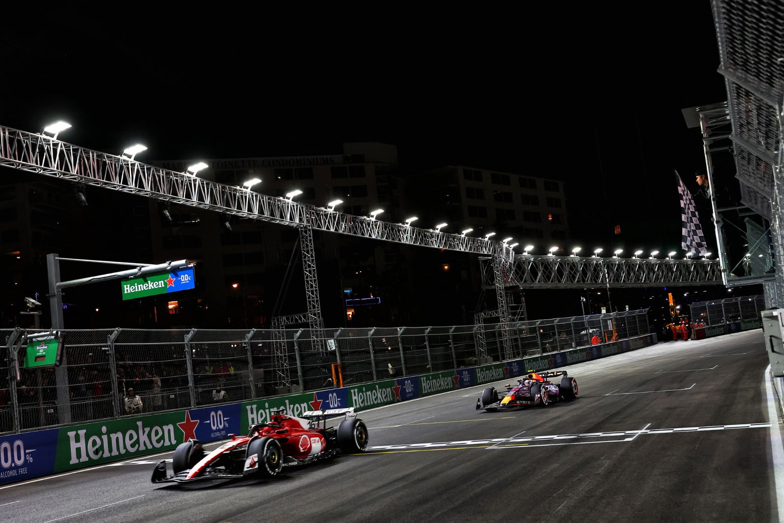 Charles Leclerc (MON) Ferrari SF-23 takes the chequered flag at the end of the race to finish second ahead of Sergio Perez