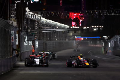 Daniel Ricciardo (AUS) AlphaTauri AT04 and Sergio Perez (MEX) Red Bull Racing RB19 battle for position. Formula 1 World