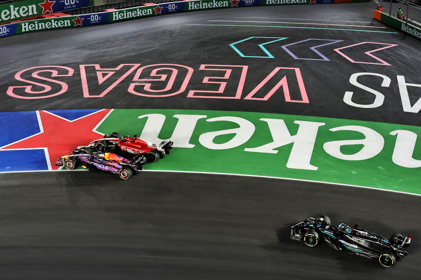 Max Verstappen (NLD) Red Bull Racing RB19 and Charles Leclerc (MON) Ferrari SF-23 battle for the lead at the start of the