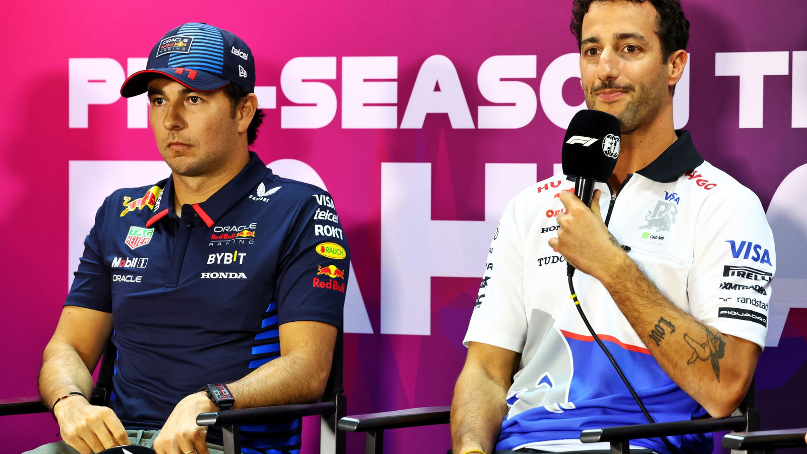 (L to R): Sergio Perez (MEX) Red Bull Racing and Daniel Ricciardo (AUS) RB in the FIA Press Conference. Formula 1 Testing,