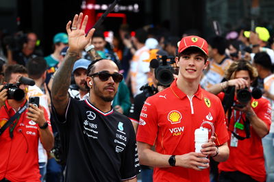 (L to R): Lewis Hamilton (GBR) Mercedes AMG F1 and Oliver Bearman (GBR) Ferrari Reserve Driver on the drivers' parade.