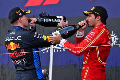 (L to R): Race winner Max Verstappen (NLD) Red Bull Racing celebrates on the podium with third placed Carlos Sainz Jr (ESP)