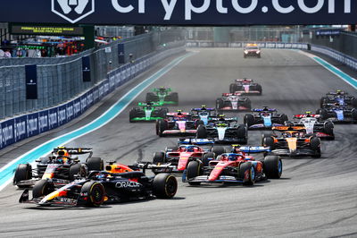 Max Verstappen (NLD) Red Bull Racing RB20 leads a late braking team mate Sergio Perez (MEX) Red Bull Racing RB20 at the