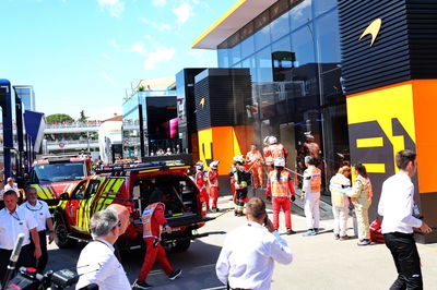 A fire in the McLaren motorhome is tended to by fire fighters. Formula 1 World Championship, Rd 10, Spanish Grand Prix,