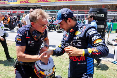 Sergio Perez (MEX) Red Bull Racing with Xavi Martos (ESP) Red Bull Racing F1 Team Physio on the grid. Formula 1 World