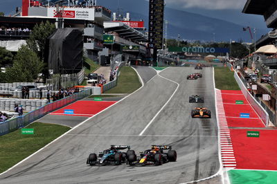 George Russell (GBR) Mercedes AMG F1 W15 loses the lead to Max Verstappen (NLD) Red Bull Racing RB20. Formula 1 World