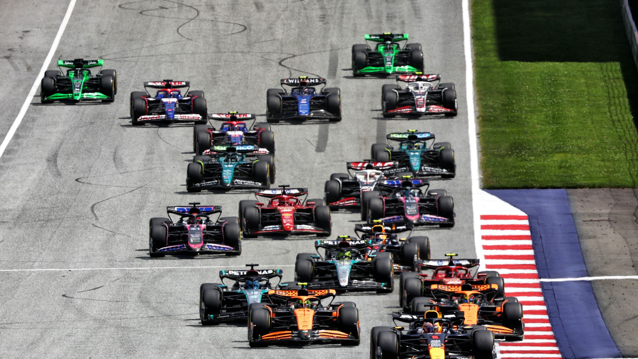 Max Verstappen (NLD) Red Bull Racing RB20 leads at the start of Sprint. Formula 1 World Championship, Rd 11, Austrian