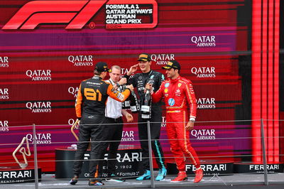 The podium (L to R): Oscar Piastri (AUS) McLaren, second; Marcus Dudley (GBR) Mercedes AMG F1 Race Engineer; George Russell