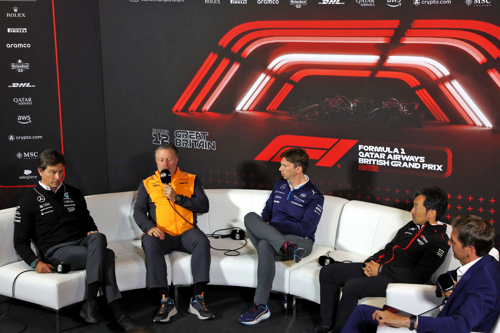 (L to R): Toto Wolff (GER) Mercedes AMG F1 Shareholder and Executive Director; Zak Brown (USA) McLaren Executive Director;