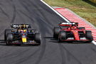 Max Verstappen (NLD) Red Bull Racing RB20 and Charles Leclerc (MON) Ferrari SF-24 battle for position. Formula 1 World