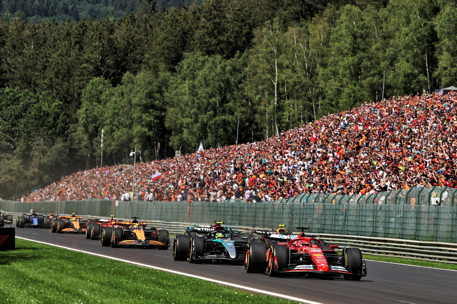 Charles Leclerc (MON) Ferrari SF-24 leads at the start of the race. Formula 1 World Championship, Rd 14, Belgian Grand