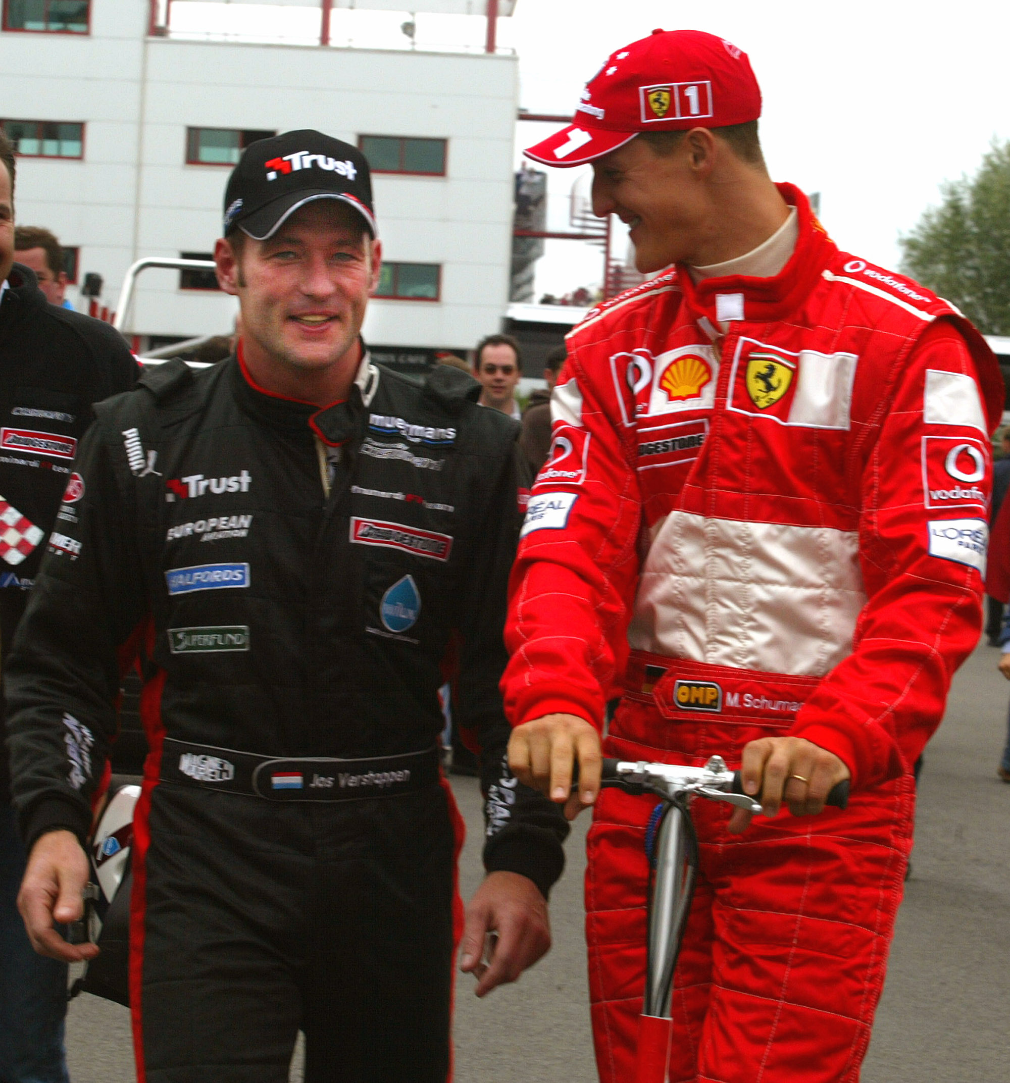 Michael Schumacher congratulates his friend Jos Verstappen on setting overnight pole position in the first qualifying
