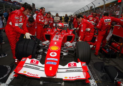 Michael Schumacher climbs into his Ferrari F2004 on the grid at the Australian GP