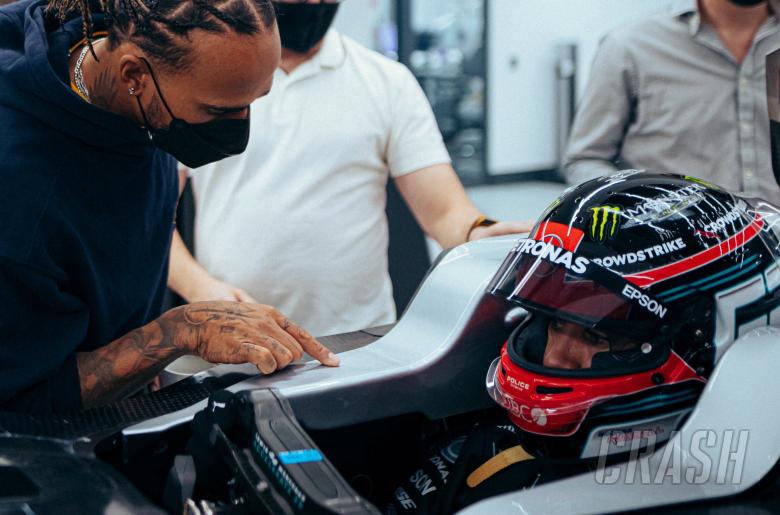 Hamilton helps out Russell at Mercedes F1 seat fitting