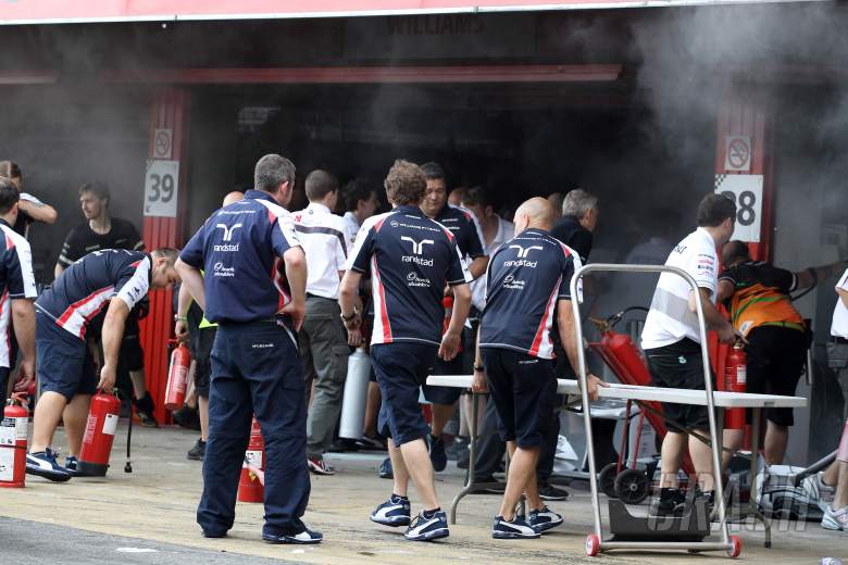 13.05.2012- A fire in the Williams pit garage after the celebrations is tended to by members of all