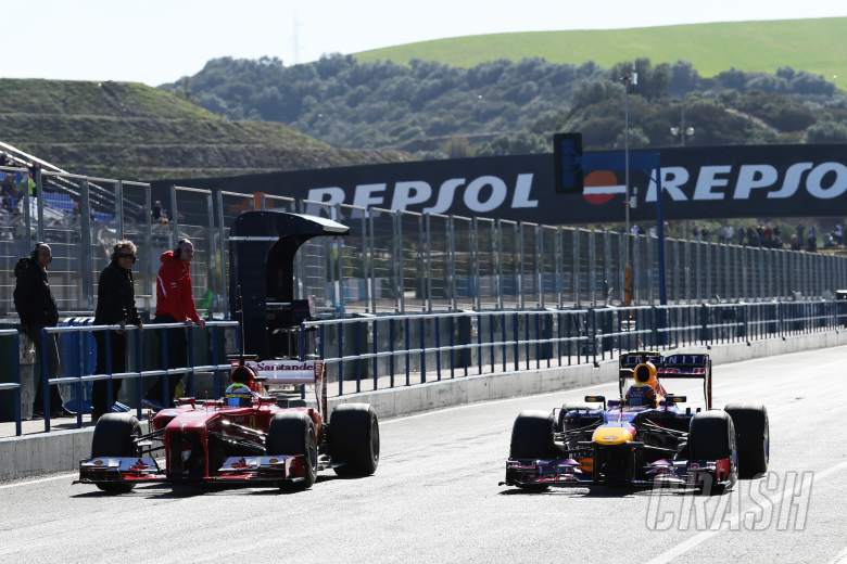 (L to R): Felipe Massa (BRA) Ferrari F138 and Mark Webber (AUS) Red Bull Racing RB9 in the pits.06.