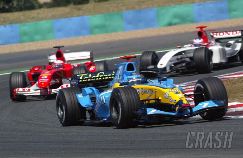Jarno Trulli, Rubens Barrichello and Jenson Button battle during the French Grand Prix