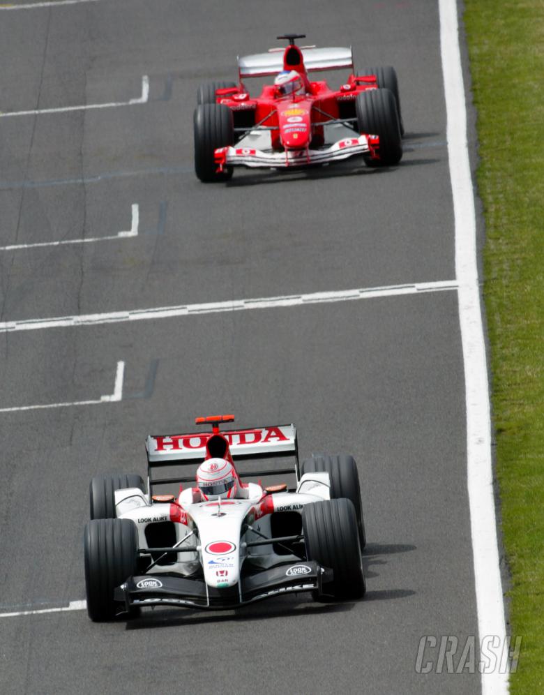 Jenson Button leads Ruibens Barrichello.