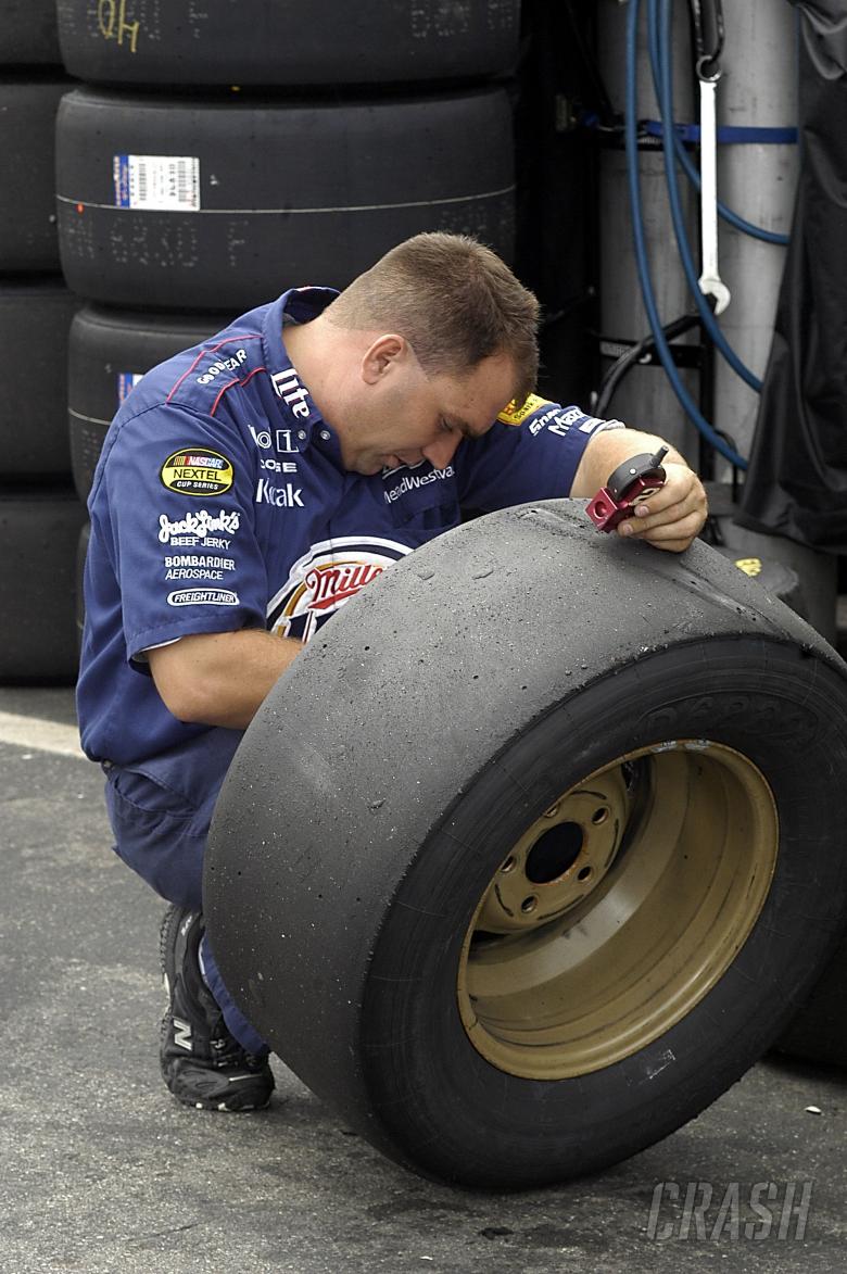 One of Rusty Wallace`s crew checks tyre pressures at New Hampshire