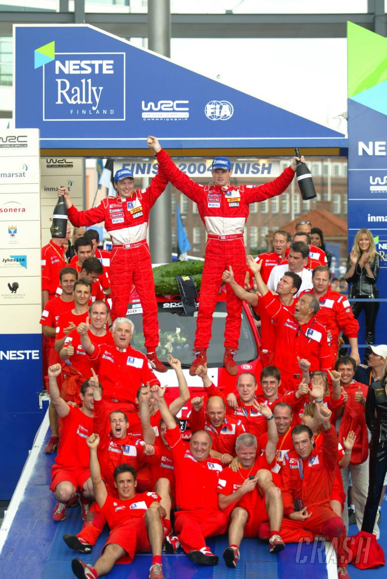 Marcus Gronholm and co-driver Timo Rautianen celebrate their Rally Finland win with the rest of the 