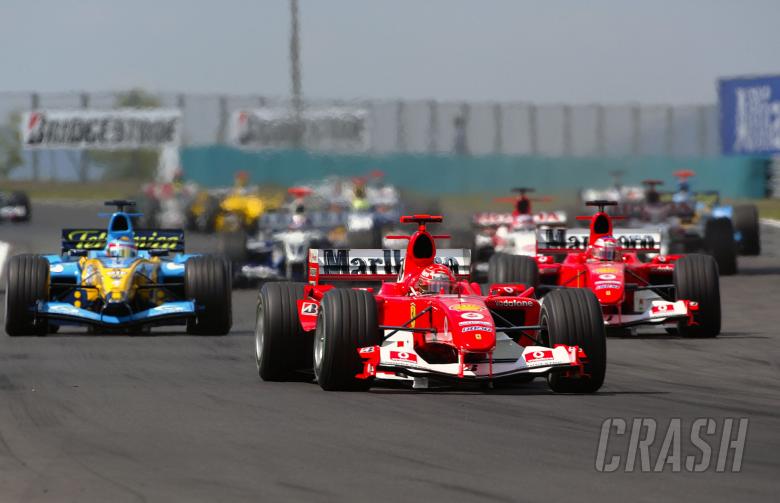 Michael Schumacher leads Ferrari team-mate Rubens Barrichello at the start of the Hungarian GP