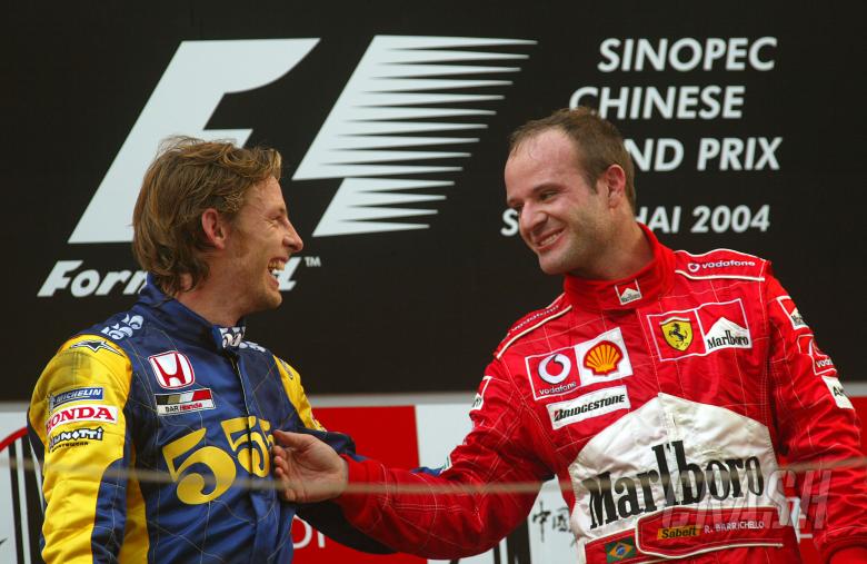 Rubens Barrichello jokes with Jenson Button on the Chinese Grand Prix podium