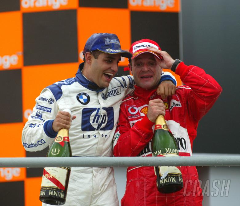 Juan Pablo Montoya and Rubens Barrichello celebrate at Interlagos