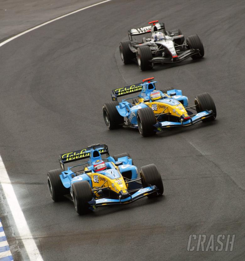 Fernando Alonso rejoins the track in front of Jacques Villeneuve and David Coulthard - all three sta