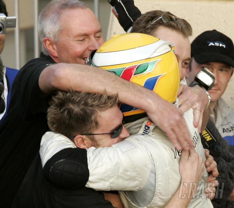 Manor boss John Booth leads the congratulations for Bahrain Superprix winner Lewis Hamilton