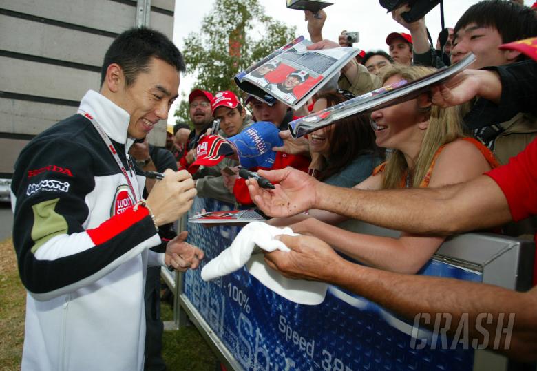 Takuma Sato signs autographs during Australian GP walkabout