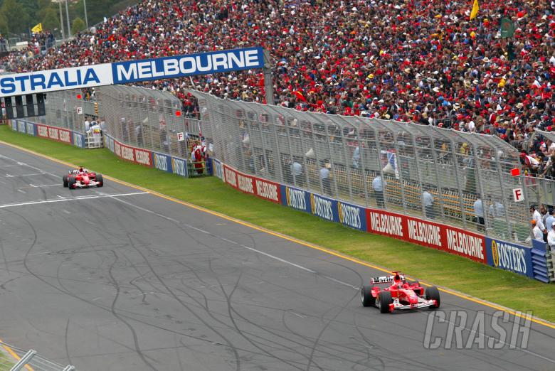 Michael Schumacher leads Rubens Barrichello at the end of the first lap of the 2004 Australian Grand