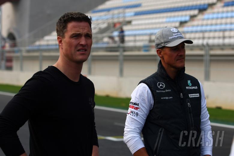 Thursday, Ralf Schumacher (GER) and Michael Schumacher (GER), Mercedes GP F1 Team, MGP W01