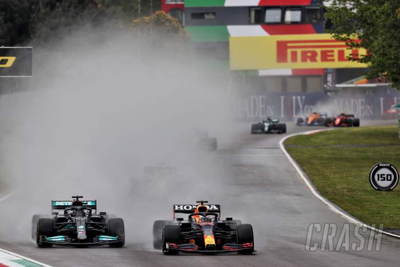 Max Verstappen (NLD) Red Bull Racing RB16B and Lewis Hamilton (GBR) Mercedes AMG F1 W12 battle for position.