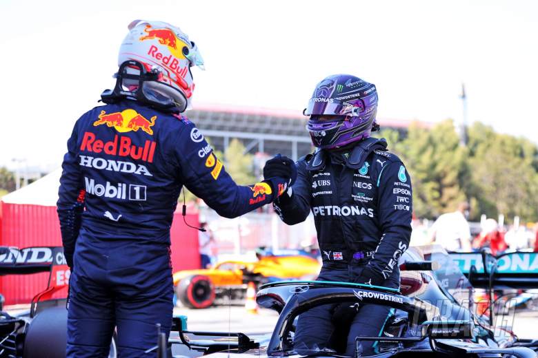 Lewis Hamilton (GBR) Mercedes AMG F1 W12 celebrates his 100th pole position in qualifying parc ferme with second placed Max Verstappen (NLD) Red Bull Racing.
