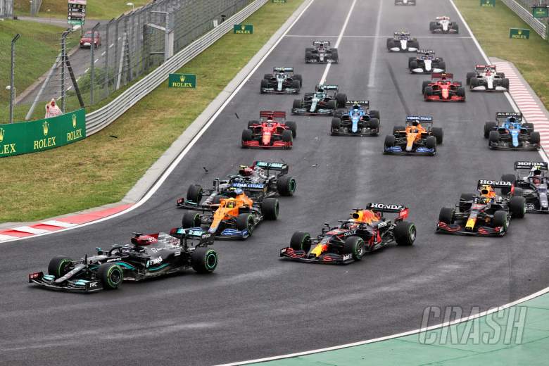 Lewis Hamilton (GBR) Mercedes AMG F1 W12 leads at the start of the race as Valtteri Bottas (FIN) Mercedes AMG F1 W12 crashes into the back of Lando Norris (GBR) McLaren MCL35M.