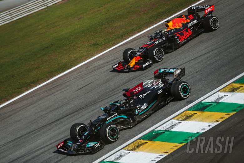 Lewis Hamilton (GBR) Mercedes AMG F1 W12 and Max Verstappen (NLD) Red Bull Racing RB16B.