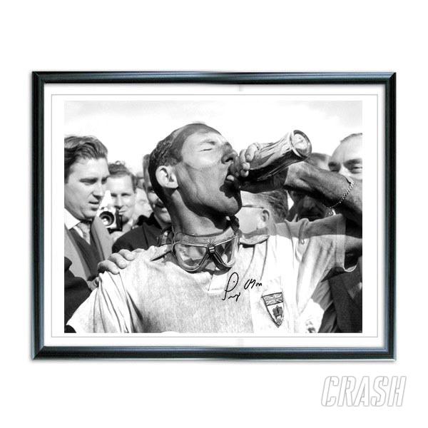 Do you fancy owning an exclusive signed photo of Sir Stirling Moss?