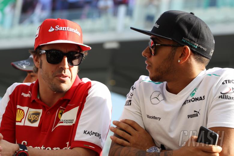- Fernando Alonso (ESP) Scuderia Ferrari F138 and Lewis Hamilton (GBR) Mercedes AMG F1